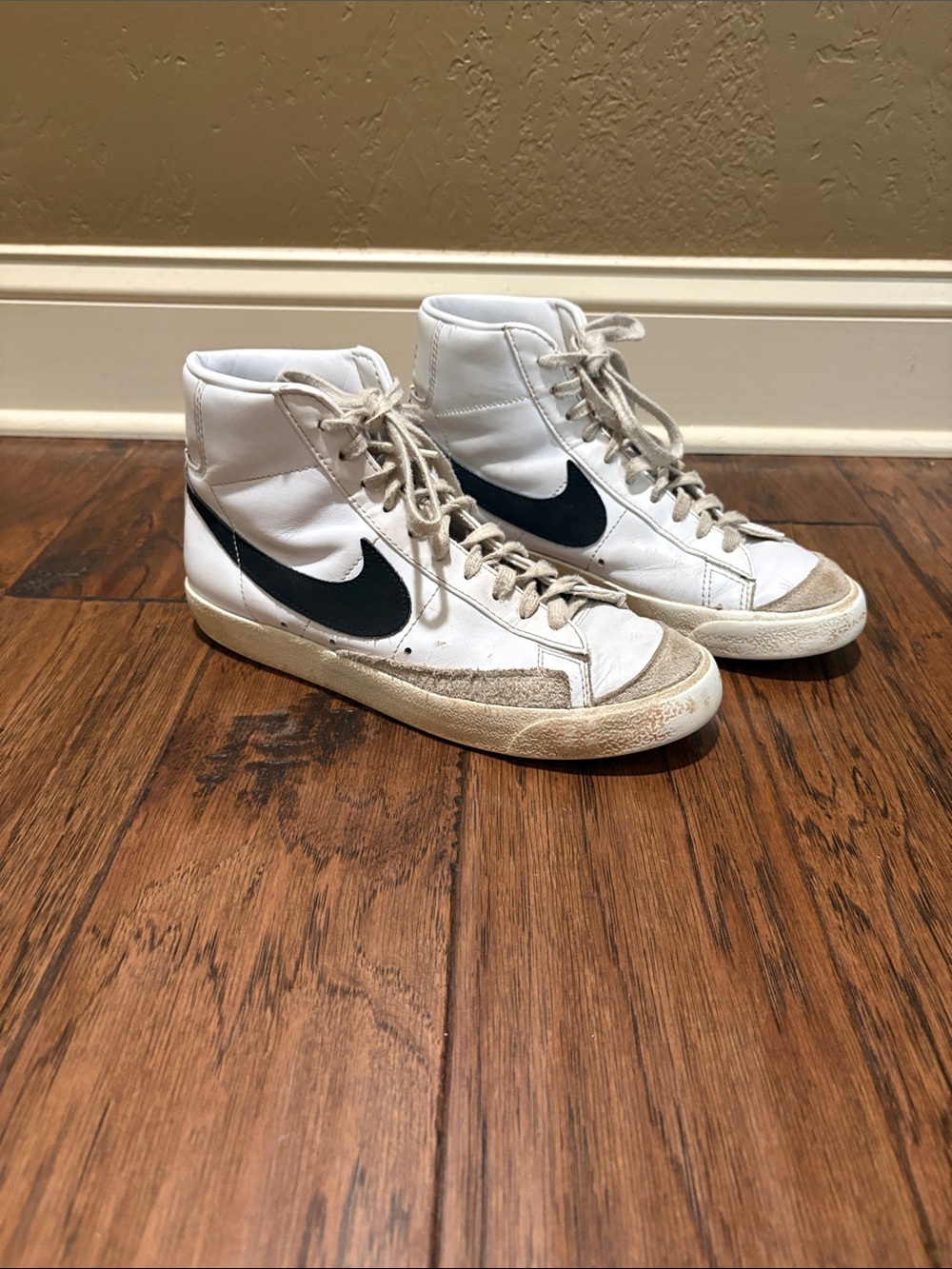Nike White High-Top Sneakers with Black Swoosh